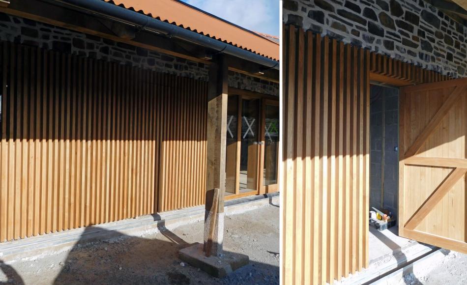 External door to service corridor concealed and married in with surrounding timber wall cladding