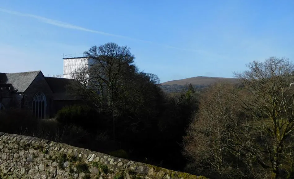 St. Petrocs on a clear Spring morning with backdrop of moorland.