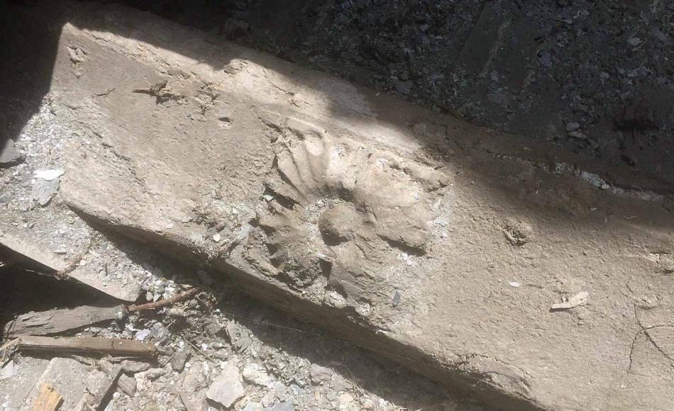 Earlier decorative carved wallplate recycled in previous re-roofing scheme