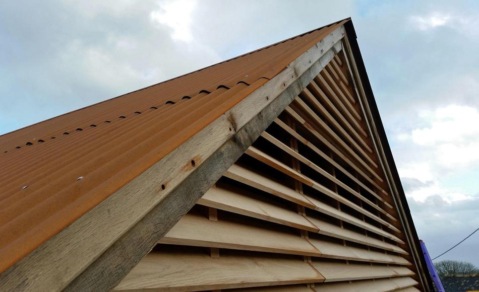 Our new oak louvred gable helps disguise service ventilation avoiding large vent pipes through the roof