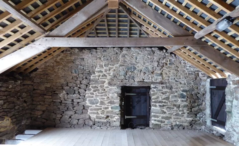 The 18th Century stable was repaired with earth mortar pointing