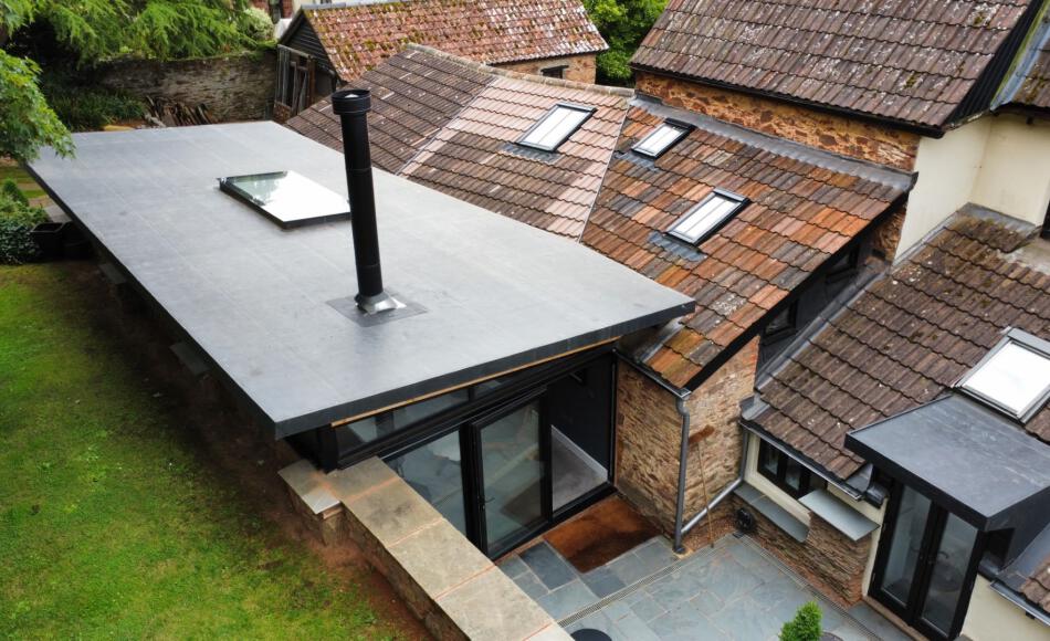 Integration of old and new roofs. The scheme sits comfortably in the listed setting