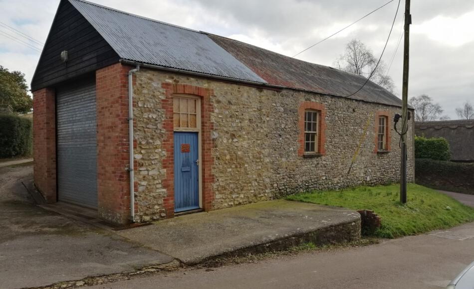 The property before the works with metal sheet roofing