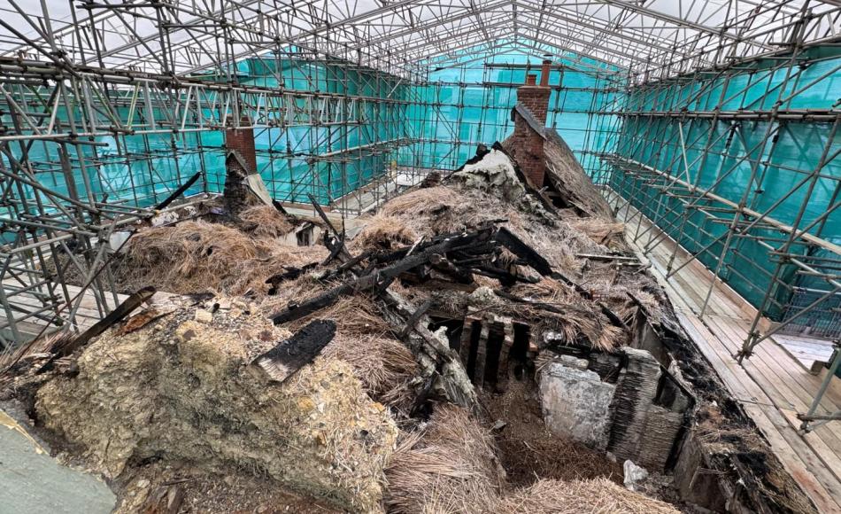 The roofed scaffold offers protection from inclement weather for the salvage and conservation works