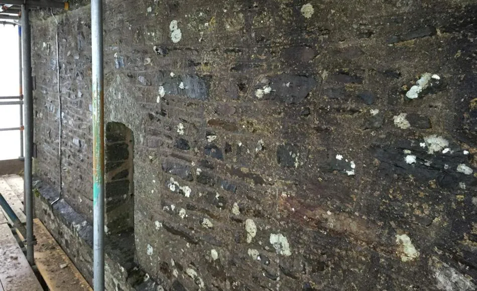 Previous hard cement mortar and render intensifying damp conditions