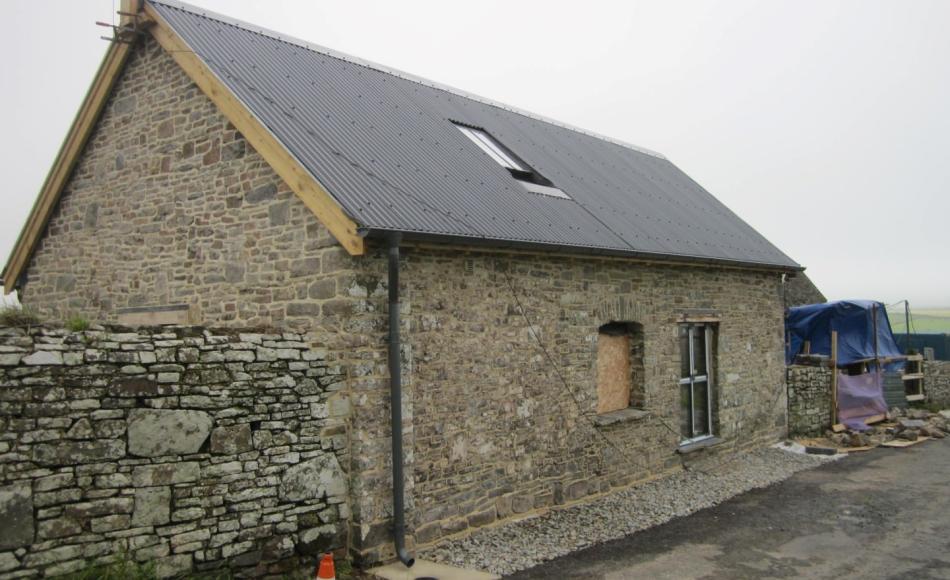 A previously blocked up opening has been reinstated as a window, preserving the historic integrity of the barn. Photo courtesy of Hiax Preservation