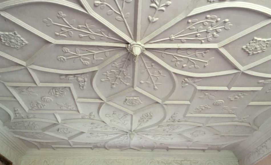 The decorative plaster work of the ceiling in the parlour