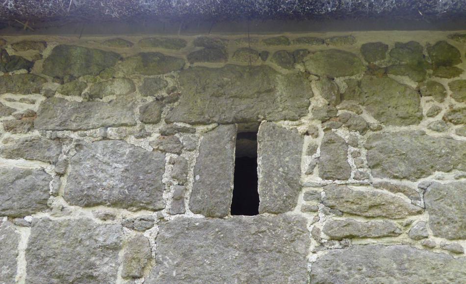 Traditional detailing of narrow ventilation opening formed using stonework. 