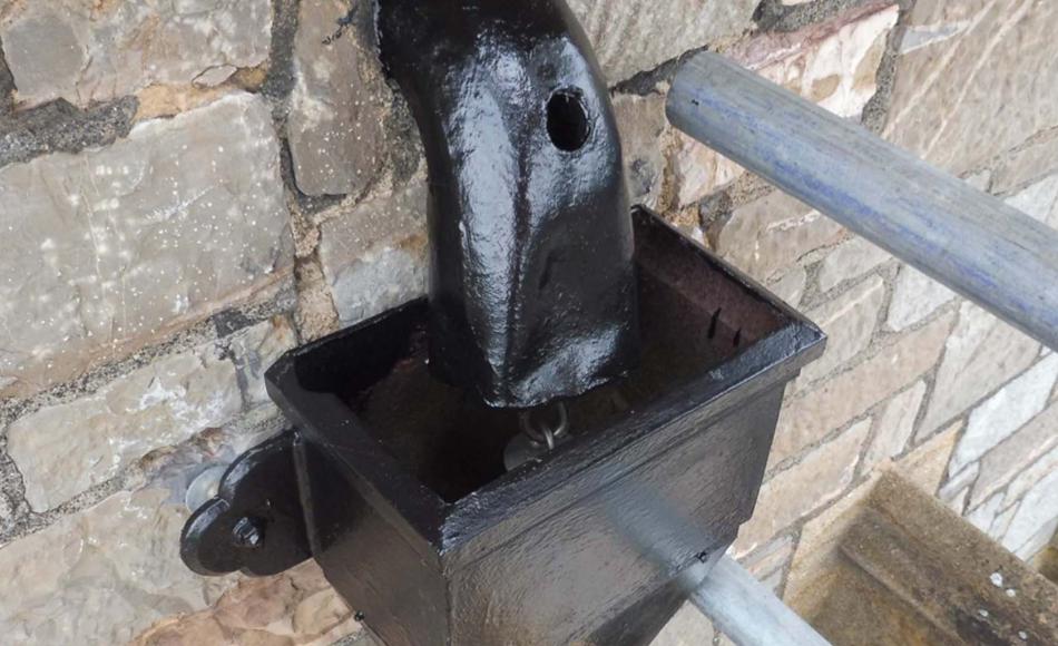 Decorations to high level cast iron hoppers and downpipes.