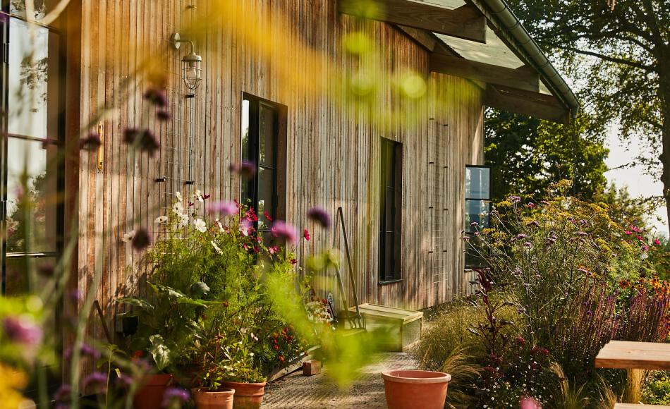 Larch cladding retains the agricultural feel of the building and roots it in the landscape