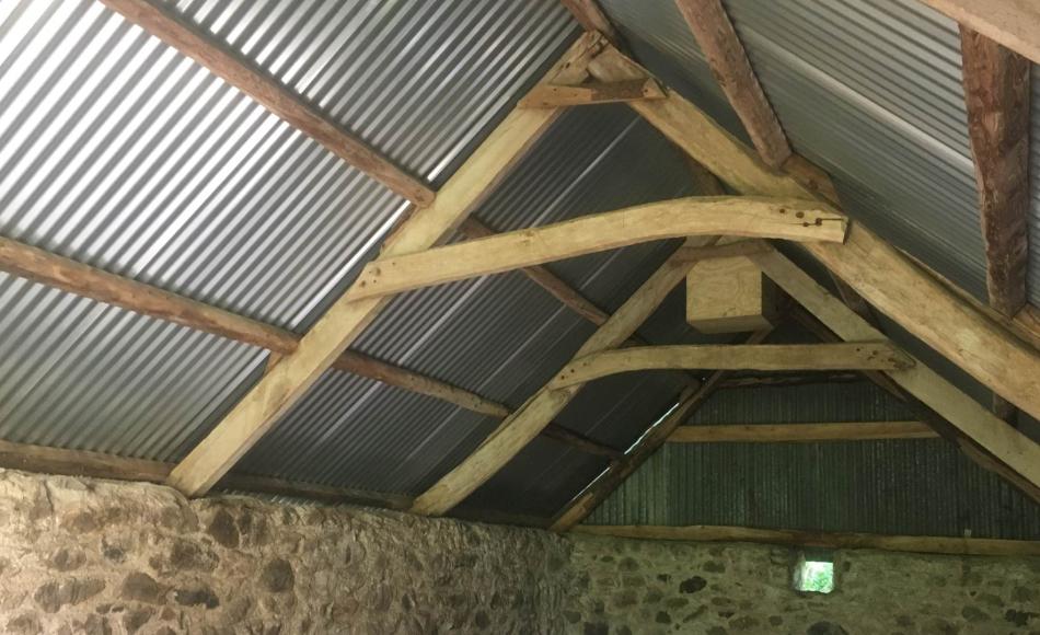 After: renewed roof sheeting on existing timbers with new barn owl nesting box
