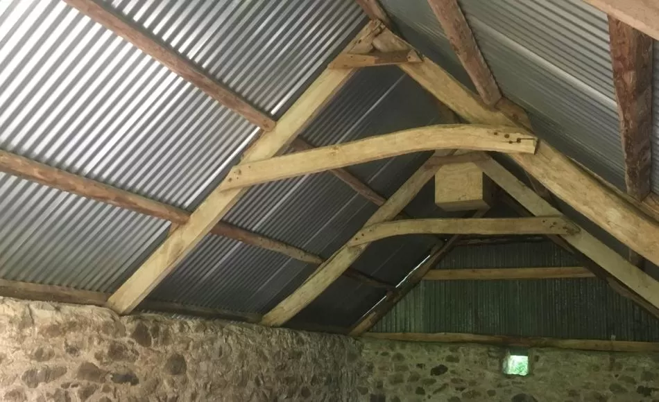 After: renewed roof sheeting on existing timbers with new barn owl nesting box