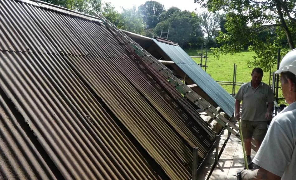 During: replacement corrugated roof sheeting in progress