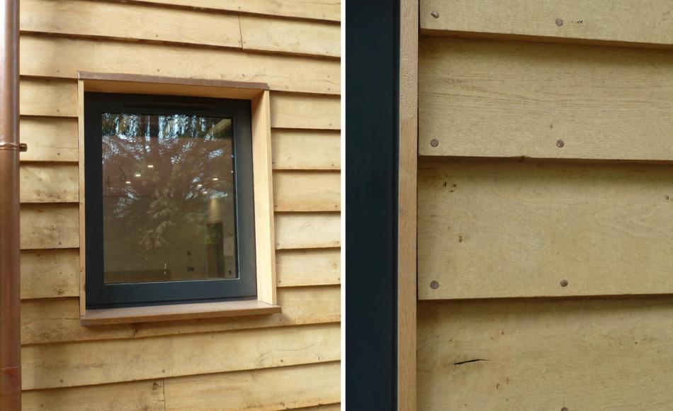 Details of new window opening; anthracite aluminium with oak boarding, copper head and cills.