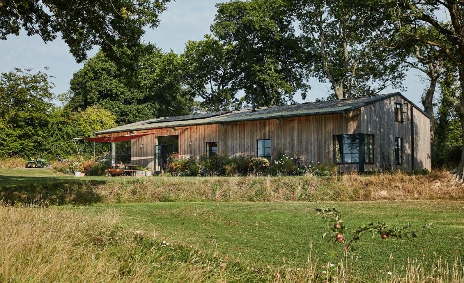Areas of long uncut grass at this barn conversion in mid-Devon have been easily and effectively incorporated into the landscape
