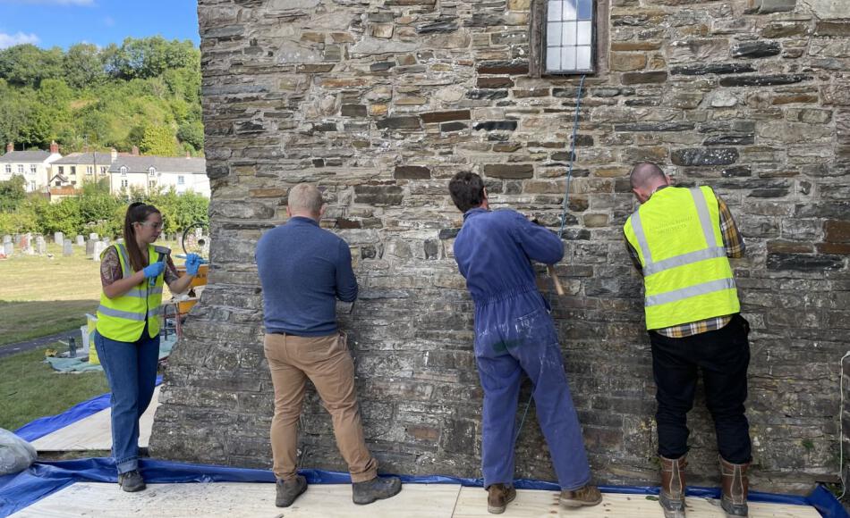 Tina getting stuck into lime pointing with the rest of the team at a CPD event