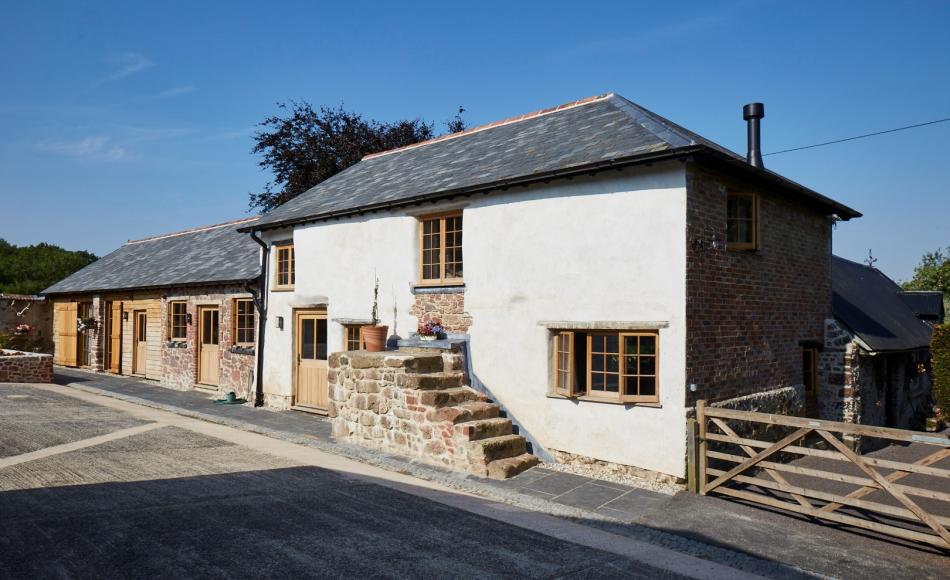 Another of Julian’s projects - Holcombe Burnell was a conversion from a tired farmhouse and cattle barn into a luxury holiday cottage. The conversion was shortlisted for an RICS heritage award. 