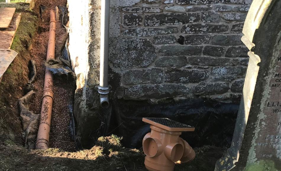 Drainage work in progress to remove failing channel drain and replace with French drain and piped rainwater system