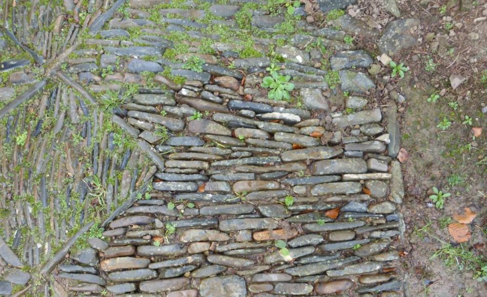 Regular clearing of weed growth will help maintain the path