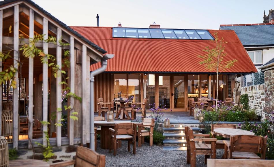 The Corten steel roof echoes the rusty corrugated barn roofs of Devon farmyards
