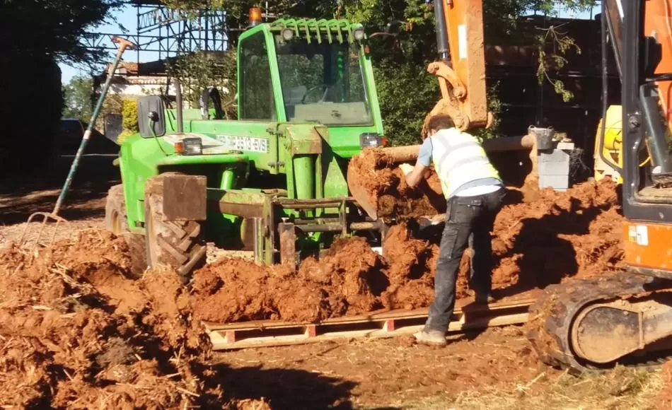 Cob being loaded onto pallet for placing on a wall