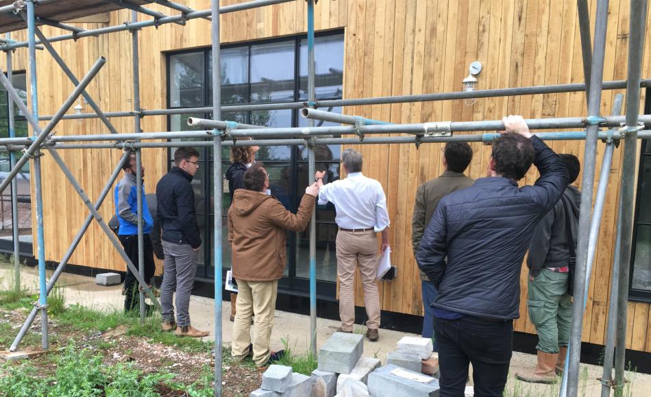 Inspecting the windows and timber cladding