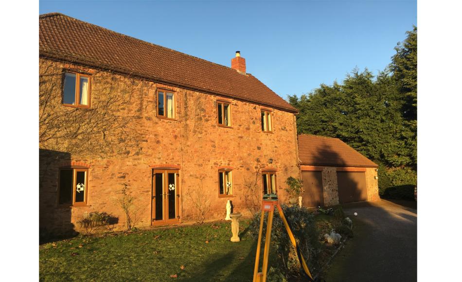 Front elevation windows will be modified to include pointed arch