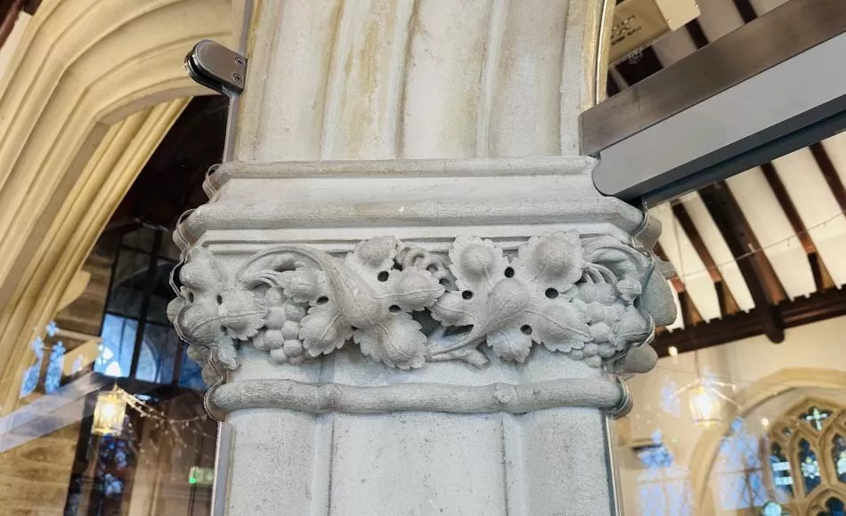 The glass was carefully cut to fit around the capital 